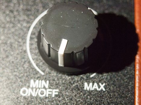 close up of black analog volume knob off max; essex; england; uk