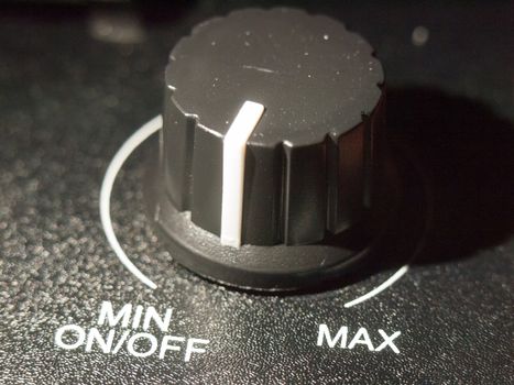 close up of black analog volume knob off max; essex; england; uk