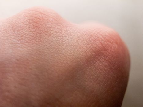 close up of pale white skin texture hand knuckle ; essex; england; uk