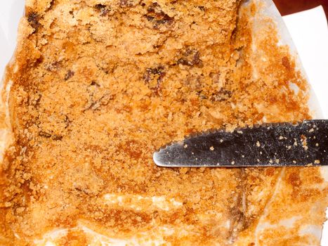 close up of brown sponge cake texture with knife; essex; england; uk