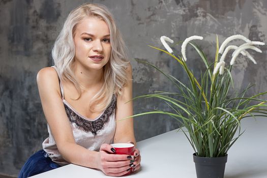 woman drinking coffee in the morning at home