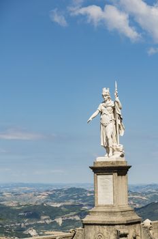view of the ancient statue of liberty against the bright blue sky in San Marino Republic