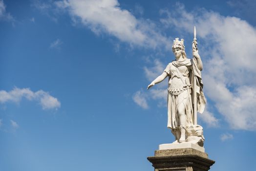 view of the ancient statue of liberty against the bright blue sky in San Marino Republic