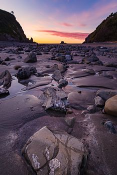 This is a color landscape photo of a vivid sunset over the Pacific Ocean.