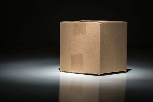 Blank Carboard Shipping Box Under Spot Light.