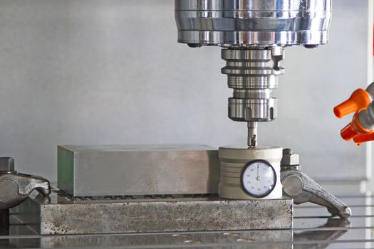 CNC machining center setting tool tip after cutting metal on box set