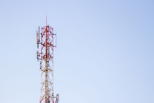 Mobile phone communication tower transmission  signal with blue sky background and antenna