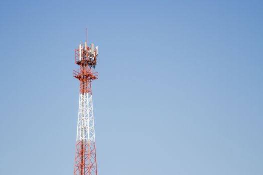 Mobile phone communication tower transmission  signal with blue sky background and antenna