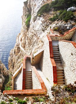 steep staircase built on a mountain overlooking the sea in Sardinia, Italy