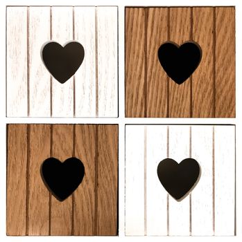 Wooden compartments with heart design. Close-up of decorative furniture.