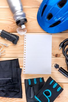 set of objects for cycling and a sheet of paper for inscription in the center of the frame