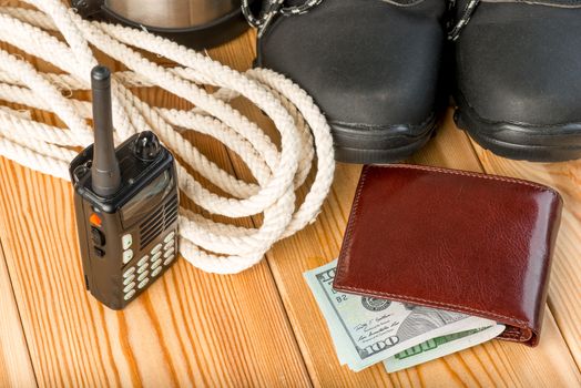 walkie-talkie, rope, shoes and some money for a dangerous winter hike - close-up objects