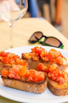 Puglia Region, South of Italy. Original Italian Bruschetta served in a traditional restaurant for lunch.