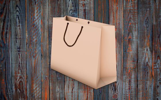 paper bag for shopping on a wooden background