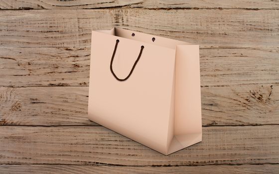 paper bag for shopping on a wooden background