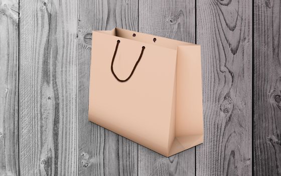 paper bag for shopping on a wooden background