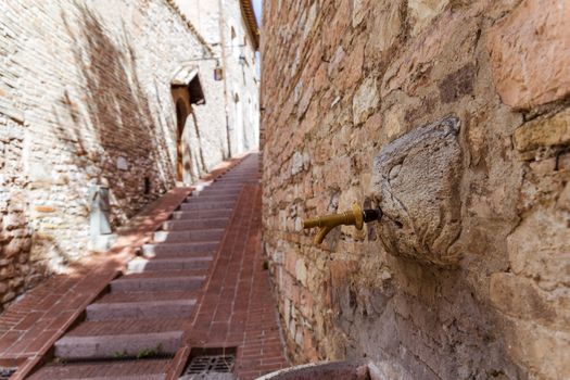 detail of an ancient fountain in Assisi (Italy)