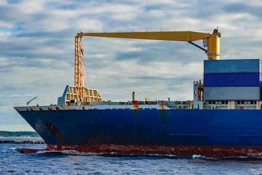 Blue container ship. World logistics and production transfer