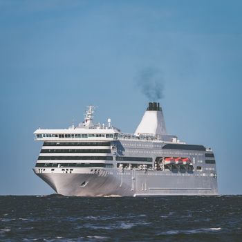 White cruise liner sailing on a clear day