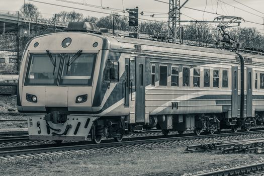 Modern passenger electric train moving at the old terminal