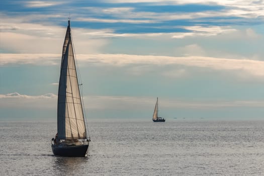 A fiew sailboats are traveling in Baltic sea. Summer journey
