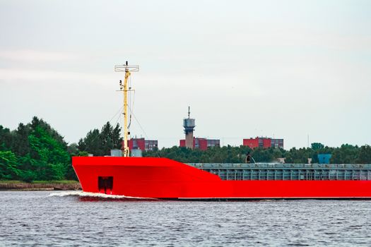 Orange cargo ship. Logistics and merchandise transportations