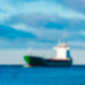 Cargo ship - soft lens bokeh image. Defocused background