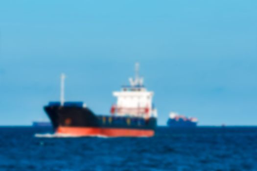 Cargo ship - soft lens bokeh image. Defocused background