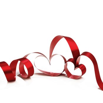 Heart shaped red ribbon isolated on white background