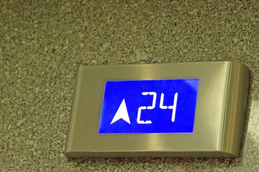The number tells the 24th floor of the elevator in under ligthing.