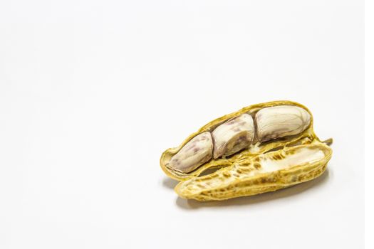 Peanuts boiled and peeled on a white background.