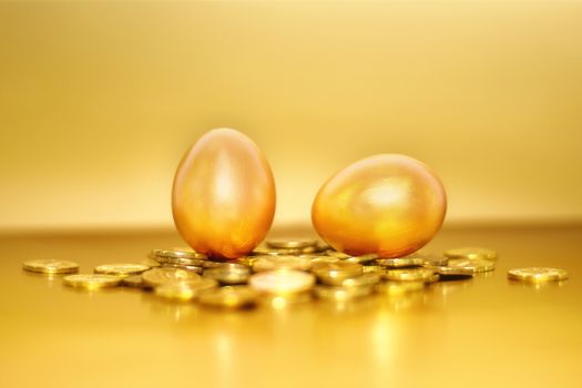 Gold coins and golden eggs, the concept of financial growth.