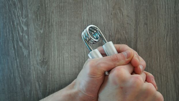 hand expander in the hand of a young athlete.