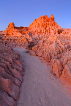 Dusk glow illuminating the amazing eroded land forms in outback desert landscape