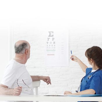 Doctor making vision test for new glasses