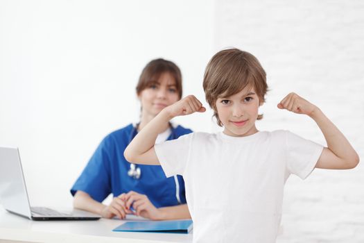 Healthy child in pediatrician office isolated on white