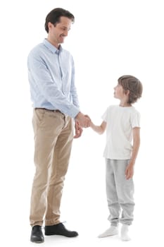 Cheerful father and son shaking hands isolated on white background
