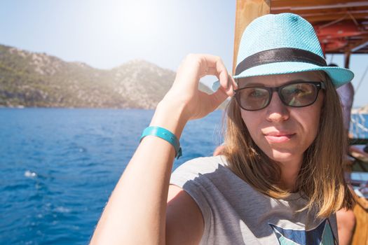 Beautiful woman enjoying her vacation on a cruise of Mediterranean Sea