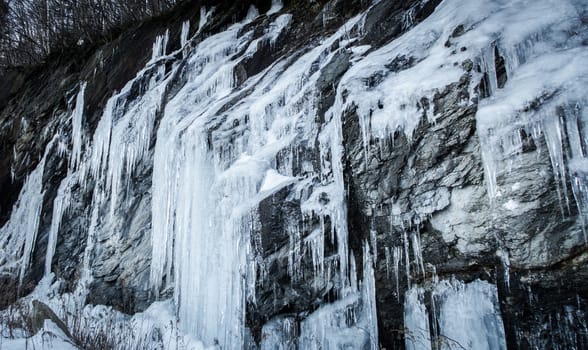 Icicle on rocks cliff in the mountain of sutton, Quebec, Canada