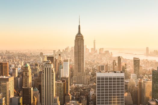 Golden sunset panoramic view of building and skyscrapers in Midtown and downtown skyline of lower Manhattan, New York City, USA.