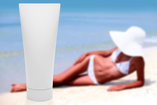 Tube of sun lotion with slim tanned woman on a beach behind. Summer holidays