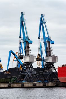 Blue cargo cranes in the port of Riga, Europe