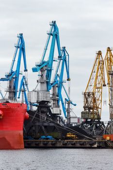 Blue cargo cranes in the port of Riga, Europe