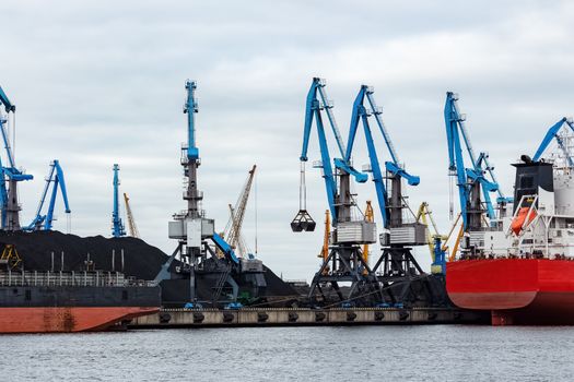 Blue cargo cranes in the port of Riga, Europe