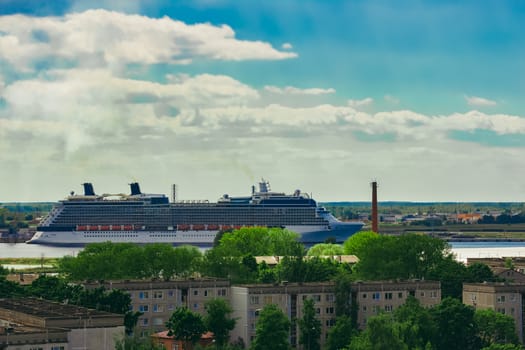 Large cruize liner. Passenger ship moored in old town