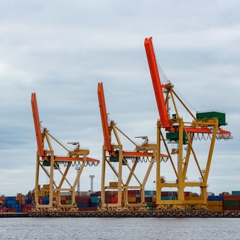 Yellow cargo cranes in the port of Riga, Europe