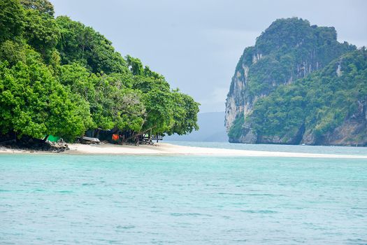 Wave of the sea on the sand beach, Beach and tropical sea, Paradise idyllic beach Krabi, Thailand, Summer holidays, Ocean in the evening as nature travel background.