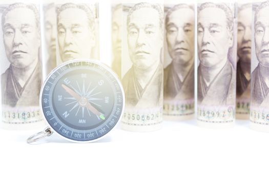Compass On Roll Of Yen Banknote, Concept And Idea Of Direction And Money, Business And Finance Concepts, Money market in Asian