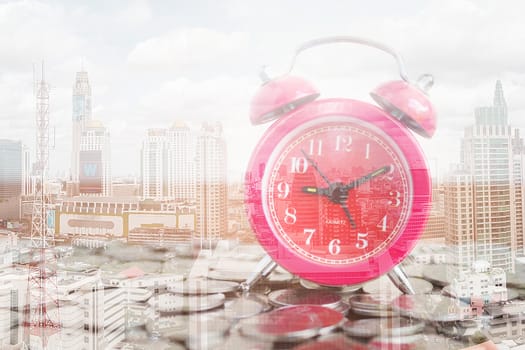 Stack of coins with red fashioned alarm clock for display planning money financial and business accounting concept, time is money concept with clock and coins, time to work at make money, Double exposure