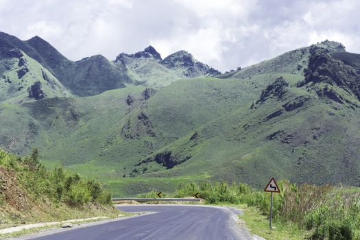 Long And Winding Rural Roads Leading Through Green Hills In Laos, The Route Between Vang Vieng - Luang Prabang